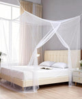 Mosquito Net Bed Canopy With Princess Lace, White Four Corner Support, installed on a bed in a bedroom, side view