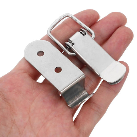 Close-up of stainless steel box latches with hook design no keyhole needed spring loaded toggle clasp heavy duty for toolboxes and doors.