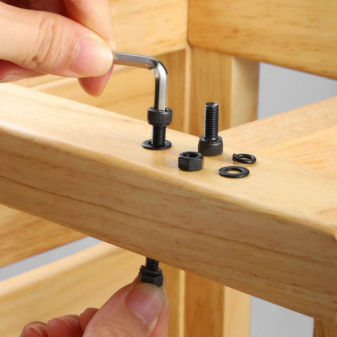 Person assembling wood furniture using Durable M5 Screws Kit 280 Pcs Set In 12.9 Grade Alloy Steel With Dope M5 Hex Socket Head Cap Screws.