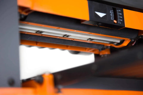 Close-up of the depth gauge and feed rollers of the Garage Ready Spiral Benchtop Thickness Planer Boasts 26 Staggered Hss Blades.