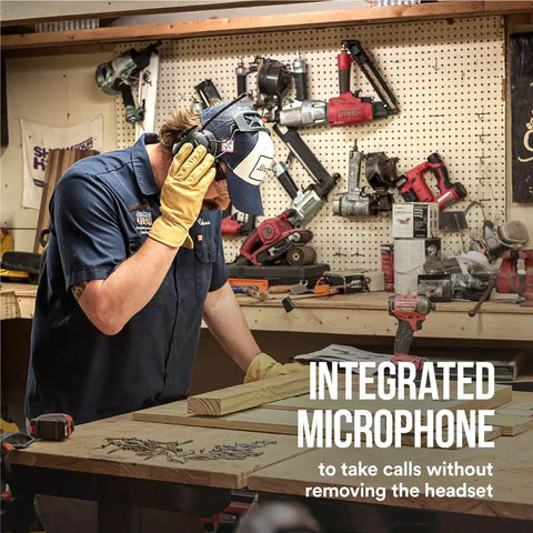 Man in workshop wearing WorkTunes Connect Wireless Hearing Protector With Bluetooth Technology And AM FM Radio 26 Decibels NRR
