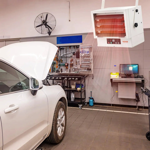 Cranks Out 5000W Garage And Workshop Heater With Remote, Digital Control, Fan Forced Heat, Wall Or Ceiling Mount, 9 Hour Timer, Overheat Protection, ETL Listed, Wide 50 Sq M Coverage For Fast, Even Warmth installed in a garage.