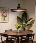 Mid Century Modern Pendant Light 15.8 Inch Wood Grain Finish Dimmable Led Island Lamp With Handheld Remote And Three Color Modes above dining table.