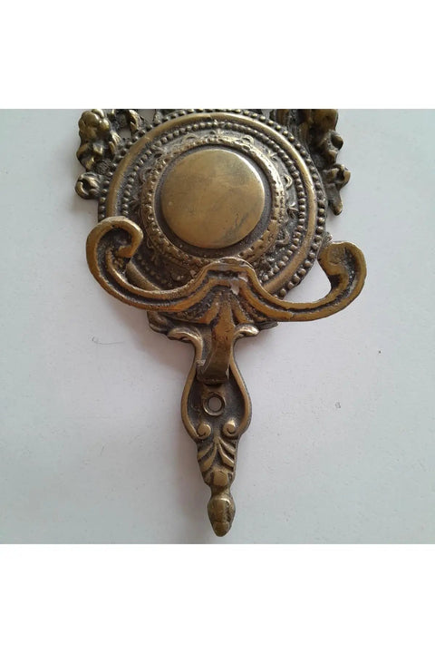 Robust Vintage Brass Wall Hook With Classic Old School Charm And Hella Tough Build For Entryway Or Bathroom Decor, Slick Decorative Single Wall Mounted Display Hook viewed from the top angle, detailed embellishments.