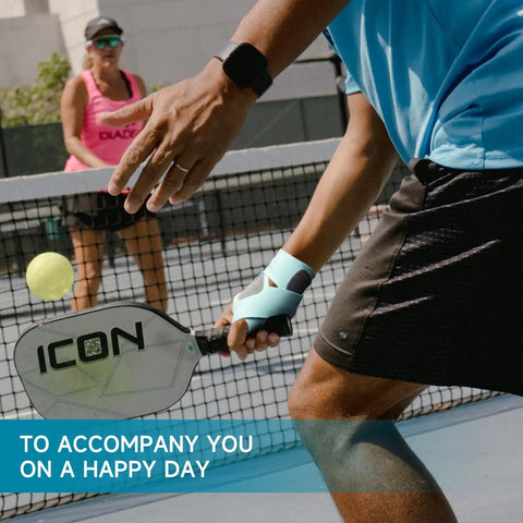 Ultra Thin Pickleball And Tennis Wrist Brace with Adjustable Compression on player during match, black left hand