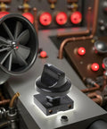 Compact Black Rotary Switch With Knob For Heavy Duty Dual Voltage 13A At 125V And 10A At 250V Four Position And Three Speed Settings Universal Speed Selector For Heaters And Industrial Gear, shown on industrial panel.