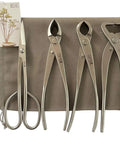 4 Piece Bonsai Tool Set All In One With 8 Inch Concave Cutter Knob Cutter Trunk Splitter And Bonsai Scissors on brown cloth