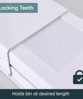 Close-up of locking teeth feature on Expandable Sliding Drawer Bin For Kitchens Sets The Bar Inside Deep Drawers in speckled white.