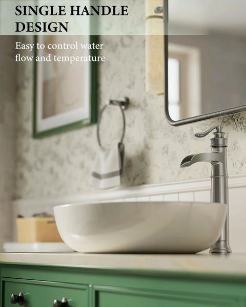 Tall Vessel Sink Faucet With Waterfall Spout Brushed Nickel Finish Single Lever Handle 1 Hole Install Pop Up Drain And Supply Lines Farmhouse Style Lavatory Vanity Faucet next to a white vessel sink on green cabinet.