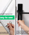 Adjustable Security Door Stop Bar With Interchangeable Caps And Rubber Tips, shown being installed on door handle