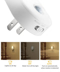 Close-up of a plug-in night light with the 'Auto' mode switch, part of the 4 Pack Plug In Motion Sensor Night Light With 3000K Warm White.