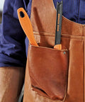 Pocket Push Stick For Table Saw With Mounting Hole in leather apron pocket, non slip ergonomic handle. Essential woodworking tool for safety.