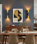 Flynix LED Indoor Wall Sconces, 5 Color Temps Dimmable Hardwired Wall Light illuminating a stylish dining area with art.