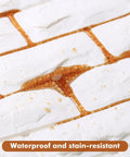 Close-up of 30 Pack 3D Faux Brick Wall Panels White Printable Peel And Stick Waterproof Foam Self Adhesive For Bedroom Bathroom Kitchen And Fireplace 29 Sq Ft Coverage With Dope Realistic Brick Texture showing waterproof feature.