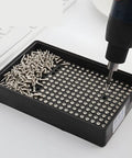 Automatic Screw Feeder Machine With Semi Auto Mode For Bulk Fastener Sorting And Neat Workshop Storage Tray holding screws in a tray.