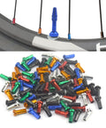 Colorful Spoke Cap Set For Mountain And Road Bikes, 60Pcs 14G Iron Nipple Caps, shown in various colors on a bicycle wheel