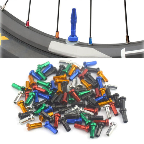 Colorful Spoke Cap Set For Mountain And Road Bikes, 60Pcs 14G Iron Nipple Caps, shown in various colors on a bicycle wheel