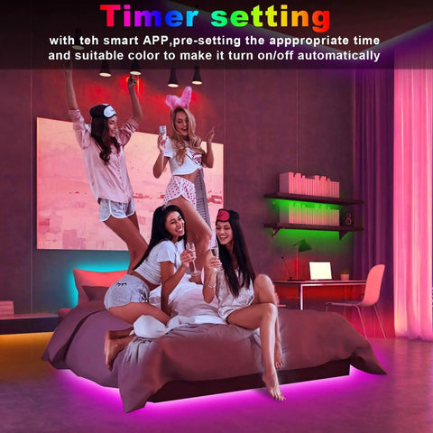 Four women in bedroom with 130Ft LED Strip Lights For Bedroom With App Control, Music Sync, Color Changing LED Strips, ambient pink lighting.
