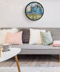 Dead Quiet Sweep Wall Clock With A Sweet Rural Blue Valley Warehouse Vibe Non Ticking Round Timepiece on wall above grey sofa.