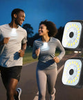 Two people jogging at night wearing Two Pack Clip On Running Lights With Rechargeable Battery Ultra Bright 24 LED Beams.