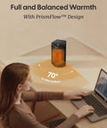 Woman using laptop with Powerful 1500W Portable Space Heater With Thermostat 70 Degree Oscillation in office for warmth