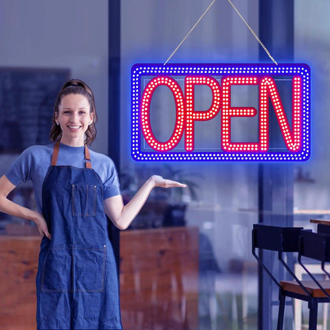 16.5 By 9 Inch Horizontal LED Open Sign For Biz hanging in a storefront with a smiling person in an apron nearby.