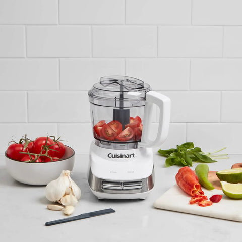 Core Custom 4 Cup Mini Chopper and Food Processor with tomatoes in bowl, auto reversing stainless steel SmartPower blade, white and stainless design
