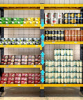 Rock Solid 4 Tier Storage Rack Heavy Duty Black Steel Welded Shelves Handles 400 Pounds Per Level Height Adjustable Boltless Construction with organized cans and boxes.