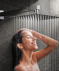 Woman enjoying All-In-One Bathroom Rain Shower System with 12 inch square shower head, chrome wall mount, high pressure water flow