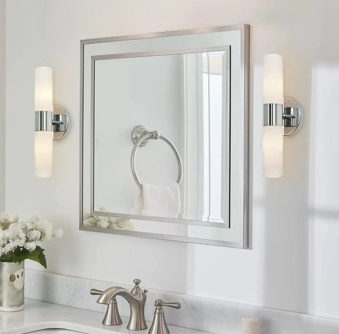 Dual 14 Inch Modern Wall Sconce With Frosted Glass Cylinder Shades In Chrome Finish next to bathroom mirror
