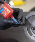 Applying blue 243 medium strength surface insensitive threadlocker to fastener on a gear to lock tight, seal, prevent loosening from vibration.