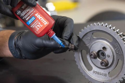 Applying blue 243 medium strength surface insensitive threadlocker to fastener on a gear to lock tight, seal, prevent loosening from vibration.