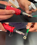 Hands using Cordless Butane Soldering Iron Kit With 3 In 1 Soldering, Jewelry And Heat Shrink Torch on wiring project.