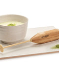 Matcha Tea And Milk Frother For Cafe Style Smooth Latte At Home No Power Needed BPA Free Plastic Durable And Portable Includes Protective Case And 2 AA Batteries shown with matcha cup