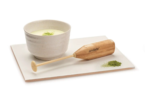 Matcha Tea And Milk Frother For Cafe Style Smooth Latte At Home No Power Needed BPA Free Plastic Durable And Portable Includes Protective Case And 2 AA Batteries shown with matcha cup
