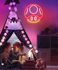 Mushroom Neon Sign For Gaming Room Decor Red LED Wall Light glowing above kids' tent in playroom, creating a fun ambiance