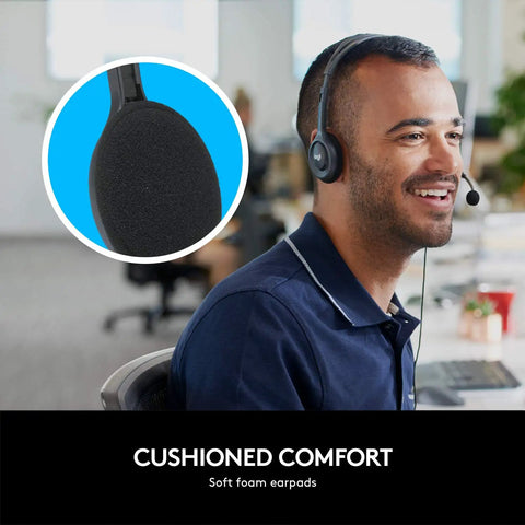 Man wearing H111 Wired Headset With Noise Cancelling Microphone in office, close-up of rotating boom mic in circle inset.