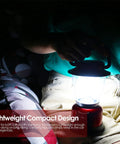 Person holding Battery Powered LED Lantern With Variable Power For Camping Dimmable COB LED Light for hiking.