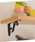 Heavy Duty Iron Triangle Shelf Brackets Black Metal Corner Supports 4 Pack mounted under wood shelf with colorful cups.