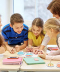 Group of children using Colorful Hot Air Balloon Sticky Notes Pack Of 12 Styles With 50 Sheets Each Mini Notebooks for classroom activity.