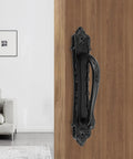 Vintage Black Sliding Barn Door Handle With Screws, Rustic Zinc Alloy Door Pull For Cabinets Gates Closets Sheds mounted on wooden door.