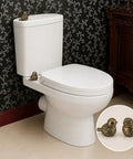 Super Dope Bronze Ceramic Toilet Bolt Covers Featuring Charming Bird Sculpture on white toilet in elegant bathroom setting.