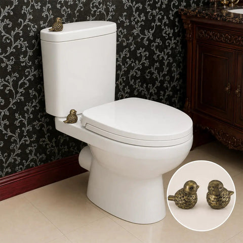 Super Dope Bronze Ceramic Toilet Bolt Covers Featuring Charming Bird Sculpture on white toilet in elegant bathroom setting.