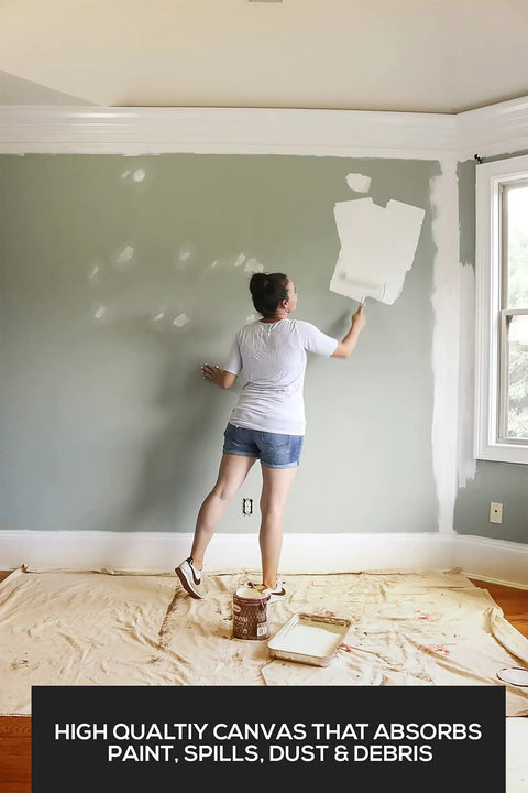 Person painting wall with protection from Canvas Drop Cloth 6x9 Feet Pack Of 2 For Painting And Home Projects Thick All Purpose Cotton Tarp