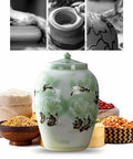 Slay Your Pantry Game With This Knockout Green Ceramic Rice Jar Featuring Hella Secure Airtight Lid with floral design, ideal for storing grains.