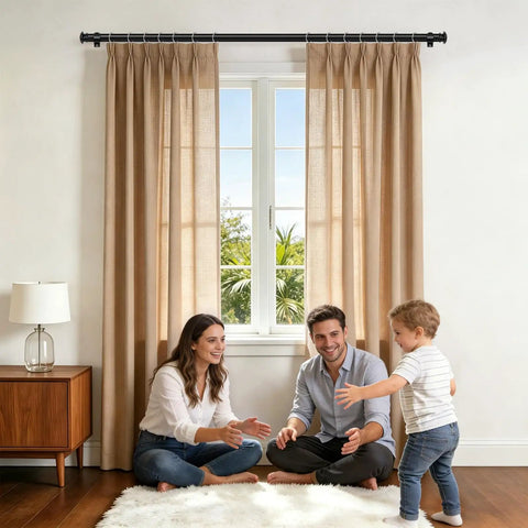 Living room with beige curtains on a telescoping curtain rod adjustable from 32 to 58 inches and 20 to 53 inches in black.