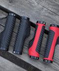 Mountain Bike Grips Lock On Aluminum Clamp Handlebar Grips For MTB BMX, ergonomic design, red and black pairs on wooden surface