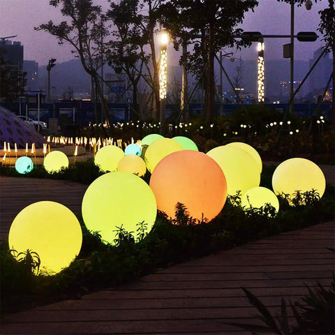 Dope 6 Inch Floating Pool Light LED Ball With Remote Control Rechargeable Battery And 16 RGB Colors glowing in a park at night