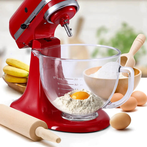 Red stand mixer with glass bowl, flour, and egg, showcasing stainless steel mixing bowl for 4.5 to 5 quart KitchenAid tilt-head mixers.