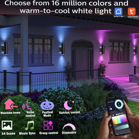 Exterior Double Up Down Outdoor Wall Lights With Remote Control illuminating a house facade in multiple colors, hand holding control.